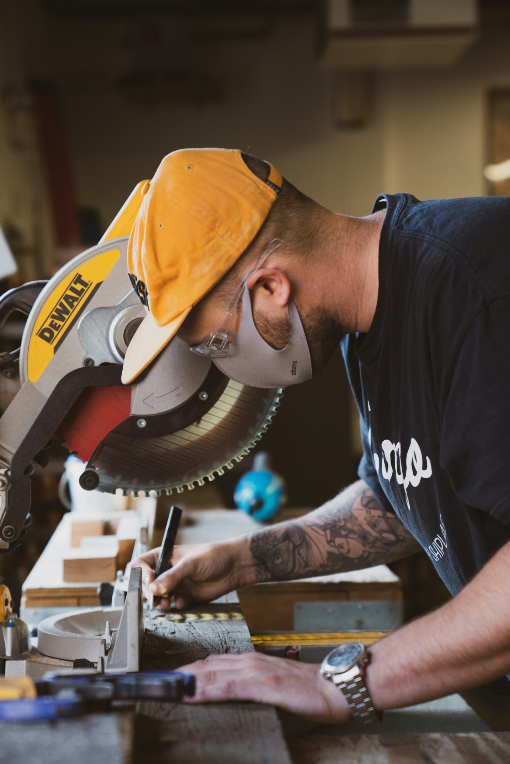 A carpenter measuring timber